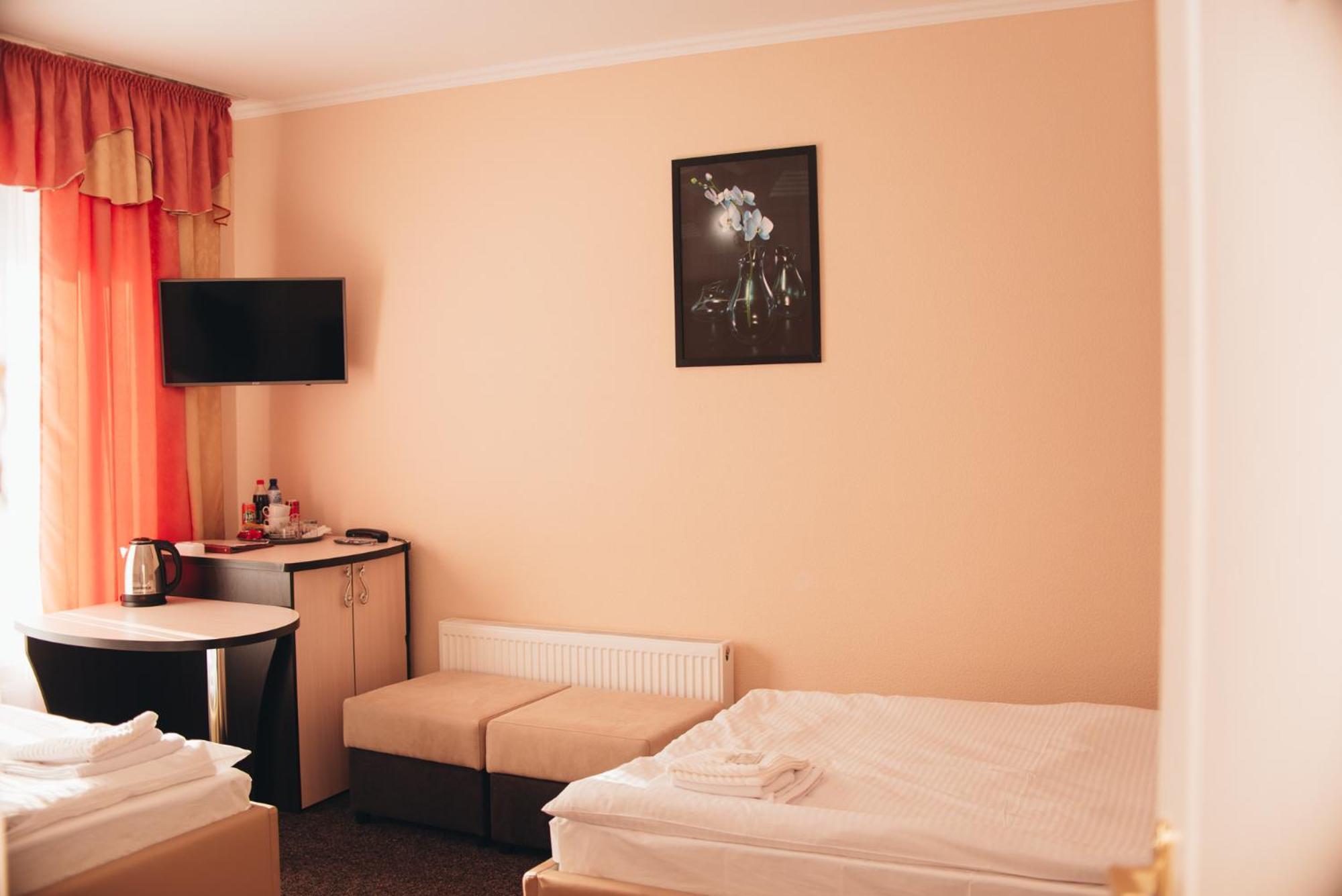 Орхідея Hotel Romny Bagian luar foto